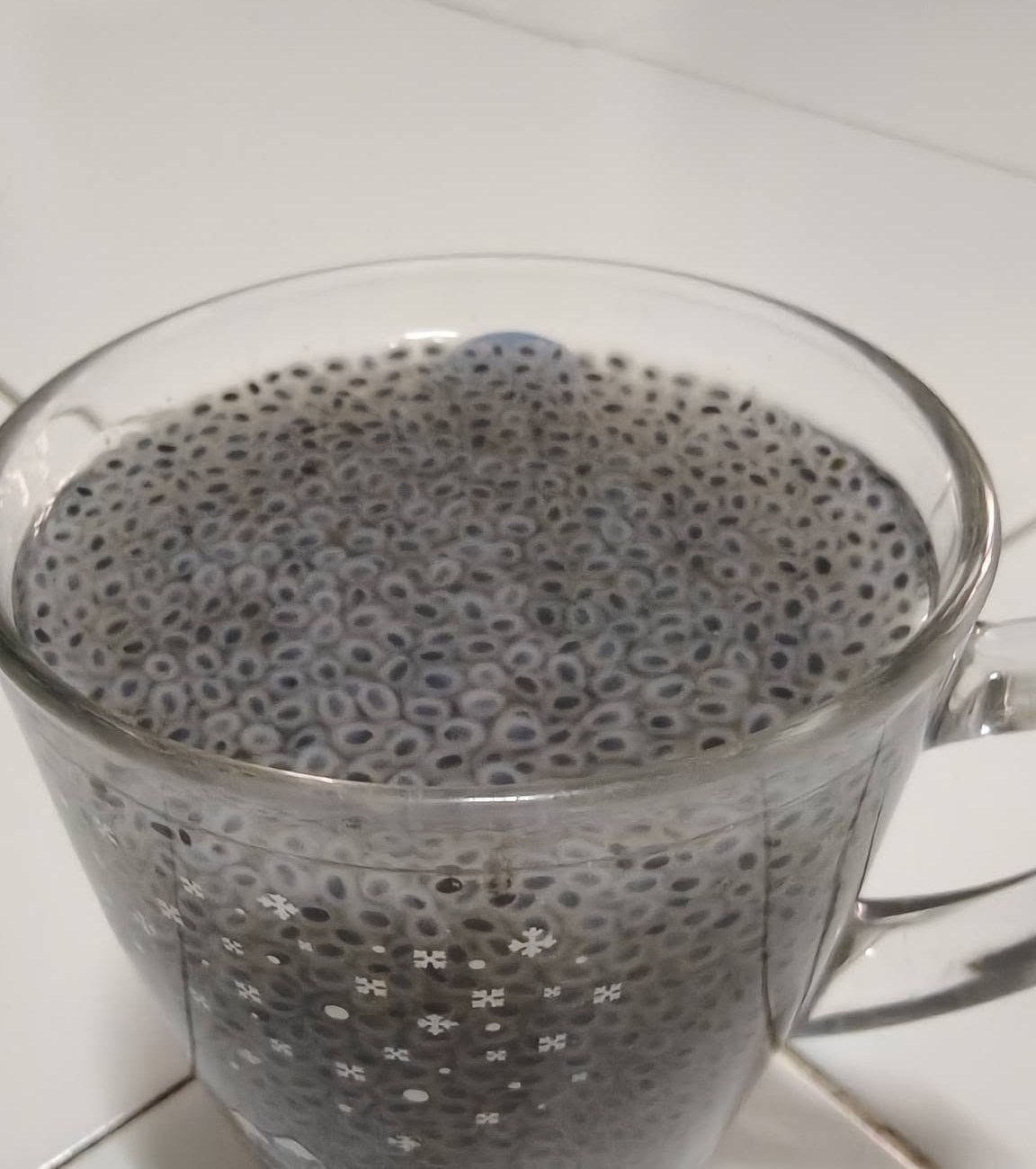Soaked basil seeds, each in its own halo of gel