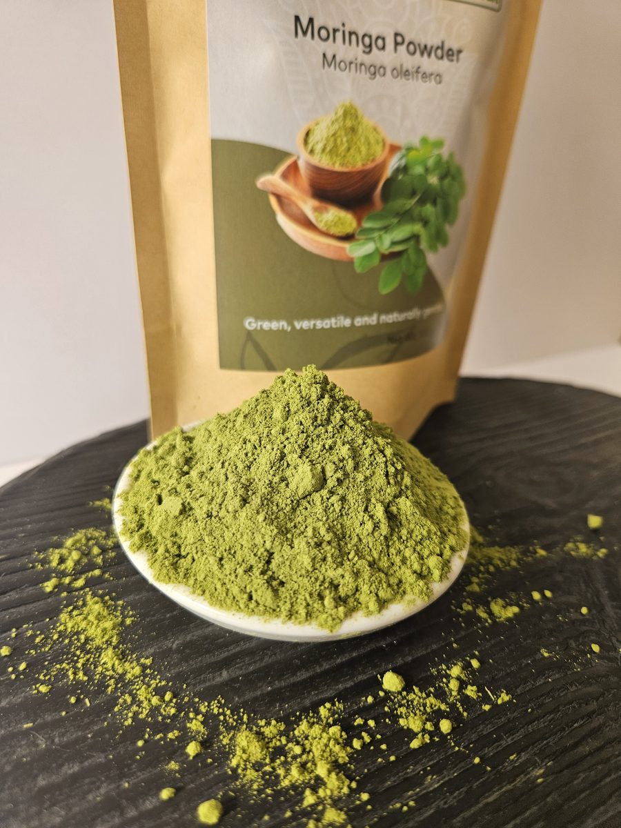 Close-up of green moringa leaf powder